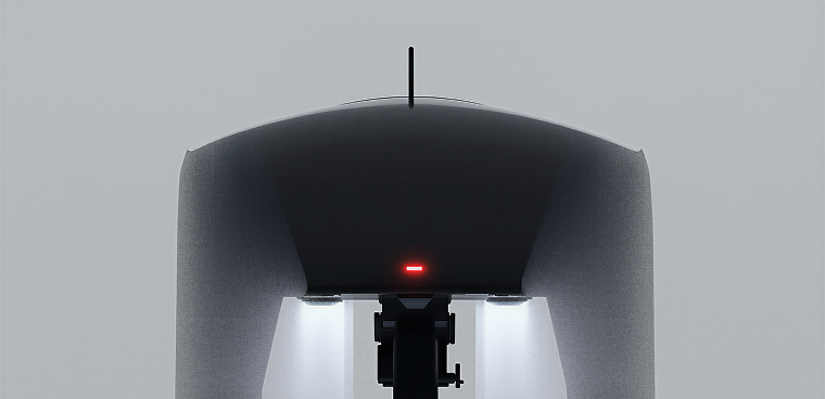 Front view of a modern drone with a single antenna and illuminated underside lights.