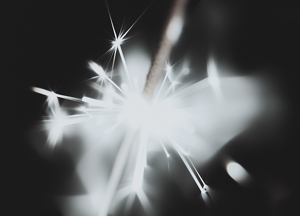 Abstract digital art of a human figure with glowing particles swirling around the head against a gray background.